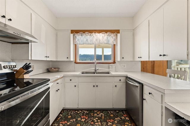 kitchen featuring backsplash, white cabinetry, sink, and stainless steel appliances