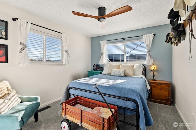 carpeted bedroom featuring a textured ceiling and ceiling fan