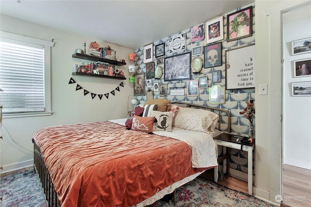 bedroom with hardwood / wood-style floors