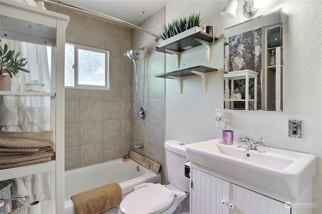 full bathroom featuring vanity, toilet, and tiled shower / bath