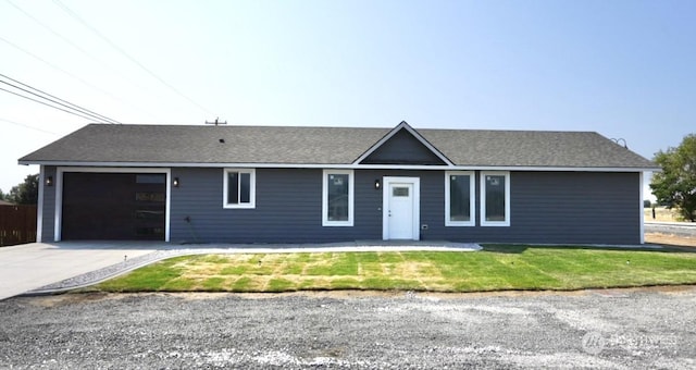 single story home featuring a shingled roof, a front yard, driveway, and an attached garage