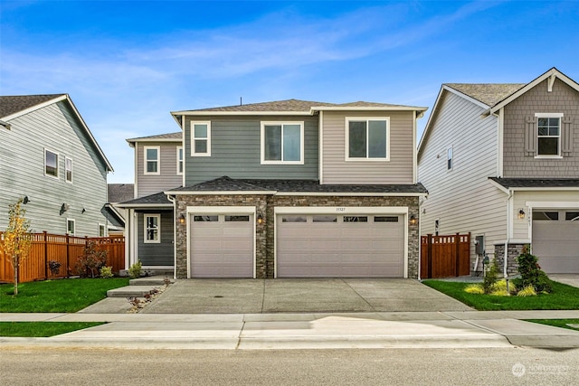 view of front of home featuring a front yard and a garage