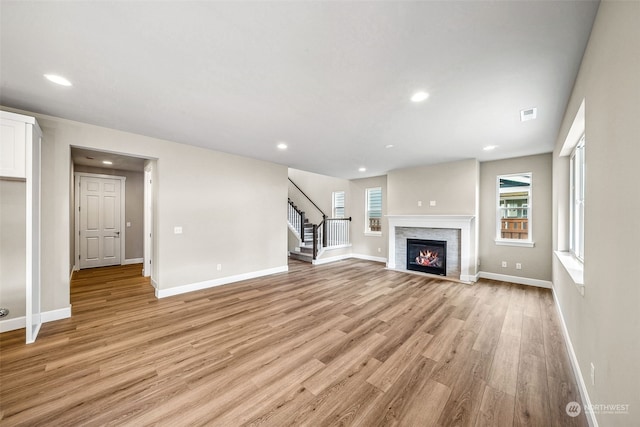 unfurnished living room featuring light wood-type flooring