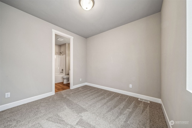 empty room with carpet flooring