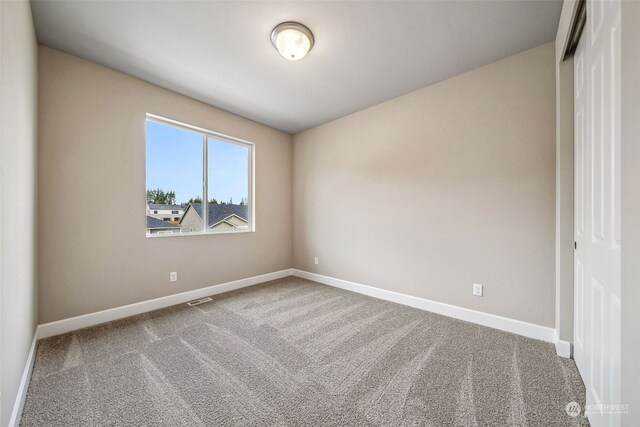 empty room featuring carpet