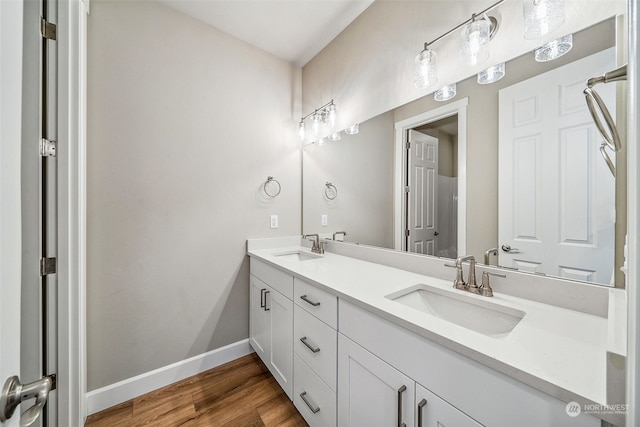 bathroom with vanity and hardwood / wood-style floors