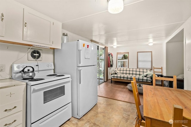 kitchen featuring white cabinetry and white appliances