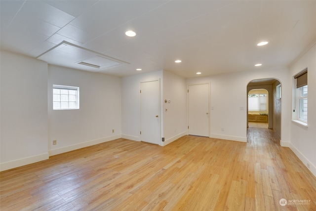 unfurnished room with light hardwood / wood-style floors