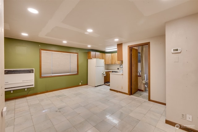 kitchen featuring white fridge and light tile floors