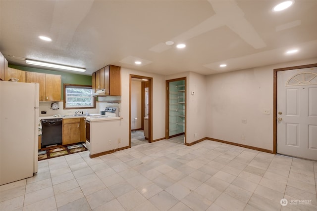 kitchen with sink, white appliances, and light tile floors