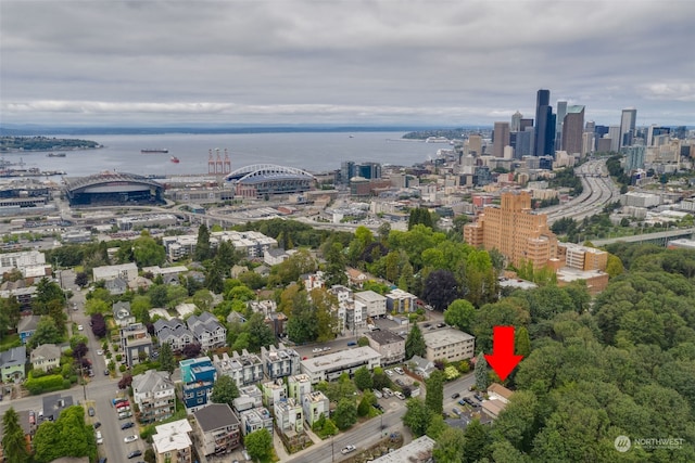 birds eye view of property with a water view