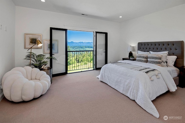 carpeted bedroom featuring access to outside