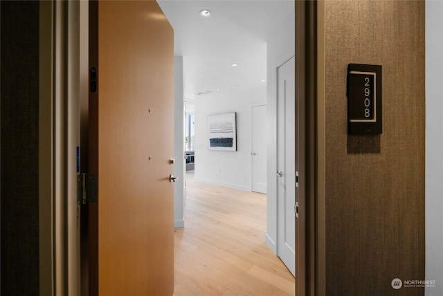 hall with light hardwood / wood-style floors