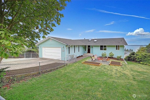 ranch-style house featuring a garage and a front lawn