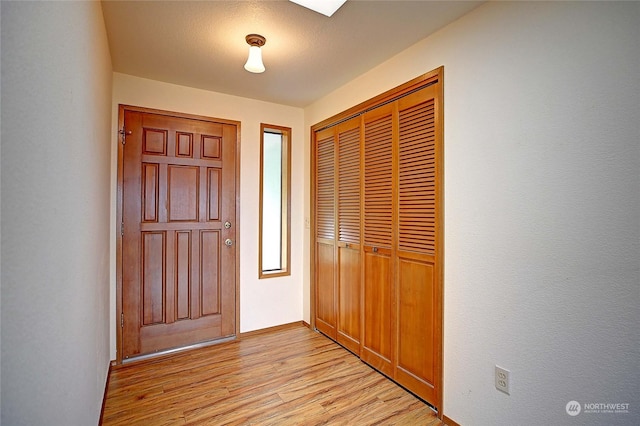 entrance foyer with light hardwood / wood-style flooring