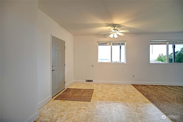 unfurnished room featuring ceiling fan