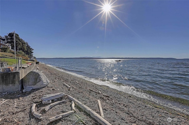 property view of water featuring a beach view