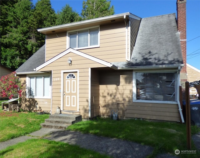 view of front of house with a front lawn