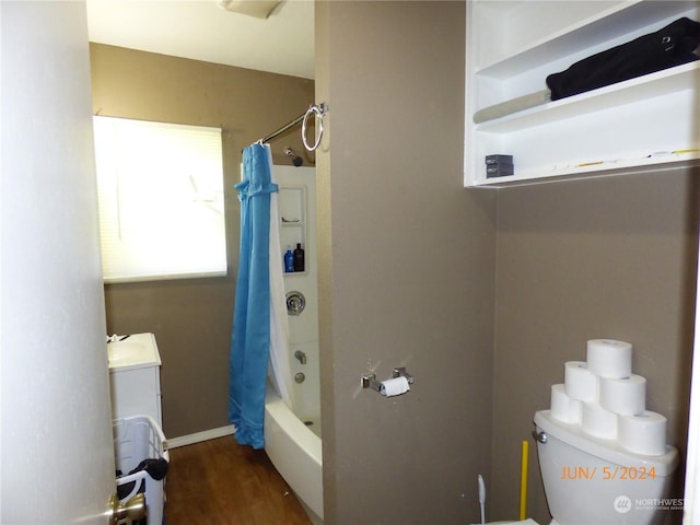 bathroom with shower / tub combo with curtain, wood-type flooring, and toilet