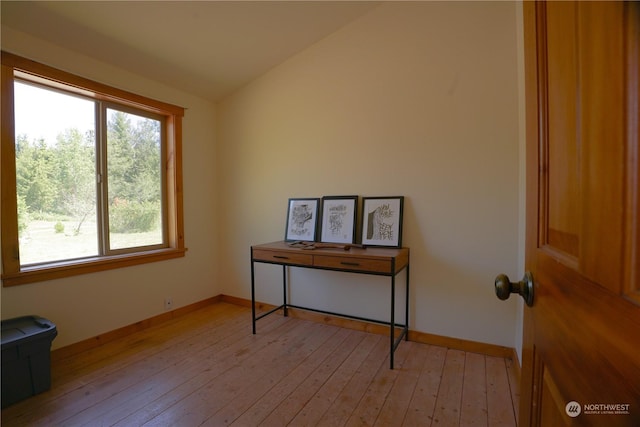 miscellaneous room featuring light hardwood / wood-style flooring and lofted ceiling