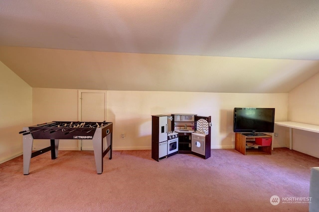 recreation room featuring light colored carpet and lofted ceiling