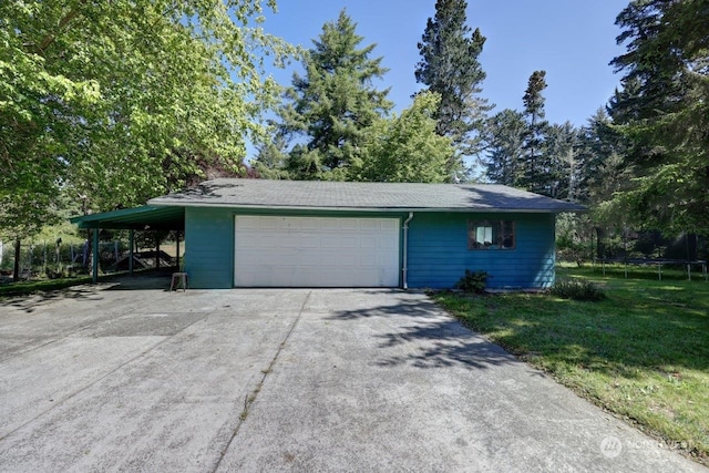 garage featuring a trampoline and a carport