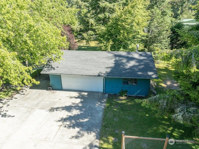 garage featuring a yard