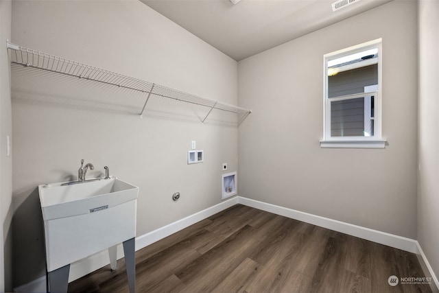 laundry room with hookup for a gas dryer, electric dryer hookup, sink, washer hookup, and dark wood-type flooring