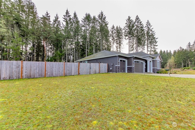 view of yard featuring a garage