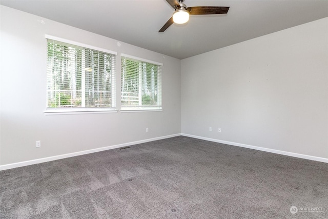 empty room with ceiling fan and carpet flooring