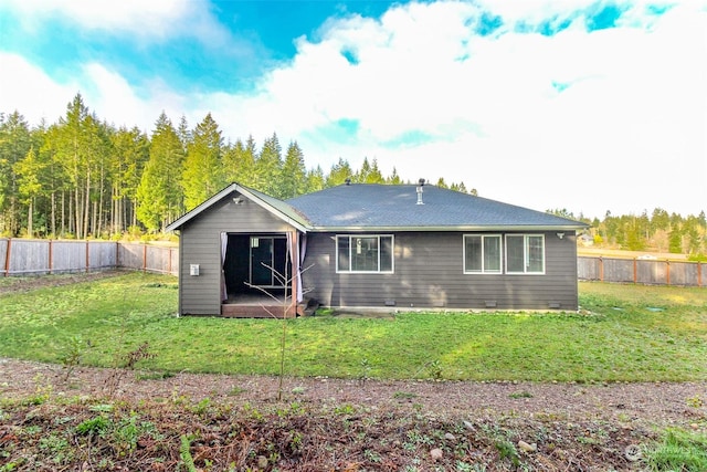 back of house featuring a yard