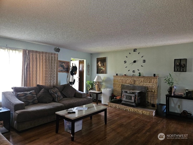 living room featuring hardwood / wood-style floors and a textured ceiling