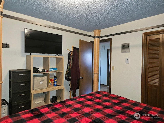 bedroom featuring a textured ceiling