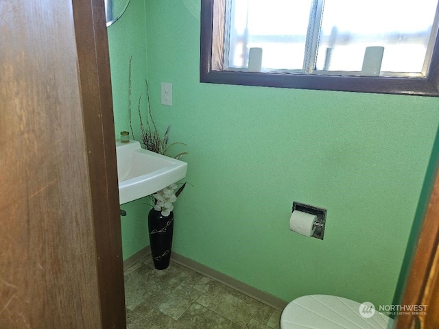 bathroom featuring toilet and sink