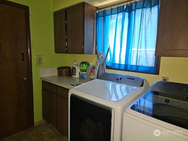 laundry area featuring cabinets and independent washer and dryer