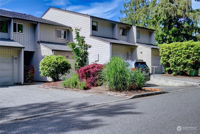 multi unit property featuring central AC and a garage