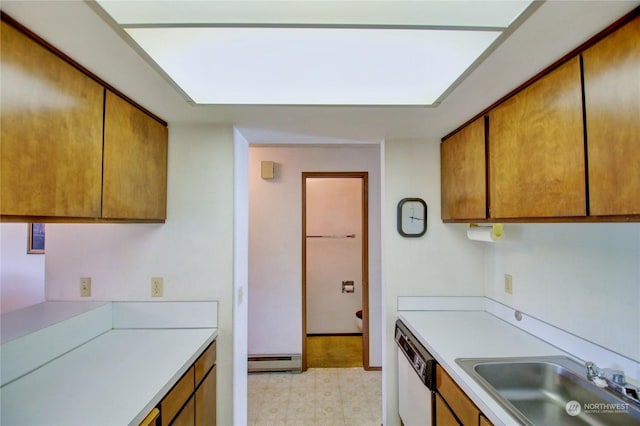 kitchen with dishwasher, a baseboard radiator, and sink