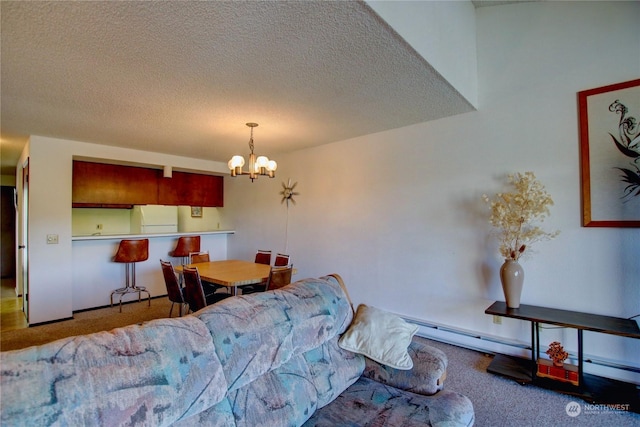 dining space with carpet floors, a textured ceiling, baseboard heating, and a chandelier