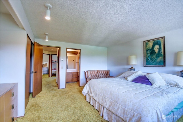 carpeted bedroom with a textured ceiling