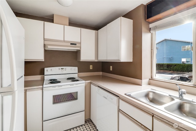 kitchen with sink, white cabinetry, white appliances, and light tile patterned floors