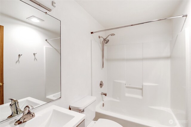 full bathroom featuring vanity, shower / bath combination, and toilet