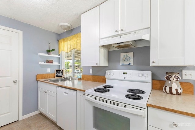 kitchen featuring white appliances, sink, a textured ceiling, and white cabinets