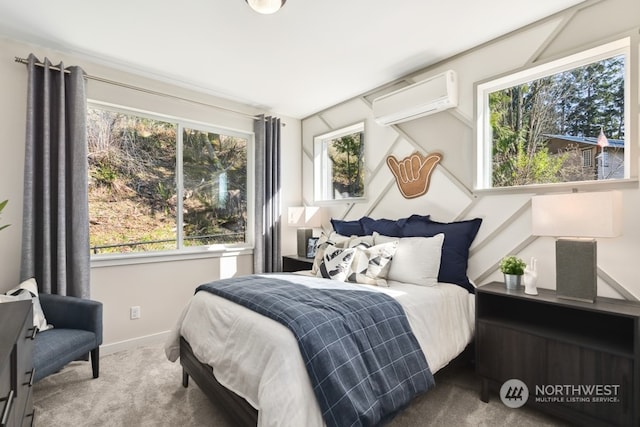 bedroom with an AC wall unit and carpet floors