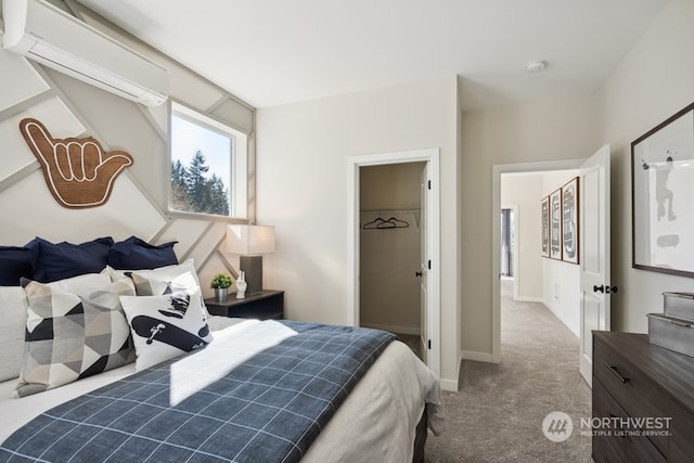 carpeted bedroom featuring a wall mounted air conditioner