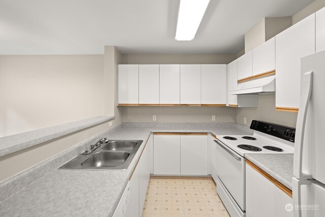 kitchen featuring light tile patterned flooring, white cabinets, white appliances, and custom range hood