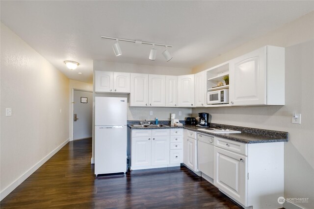 kitchen featuring track lighting, white cabinetry, dark hardwood / wood-style floors, and white appliances