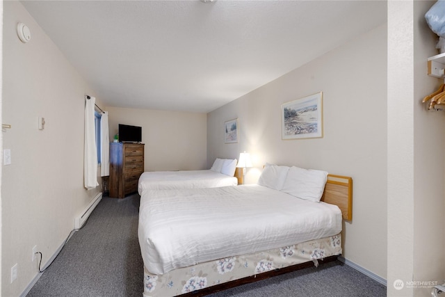 carpeted bedroom featuring baseboards and a baseboard radiator
