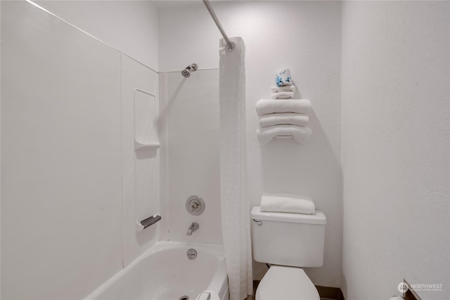 full bathroom featuring shower / bath combination with curtain and toilet