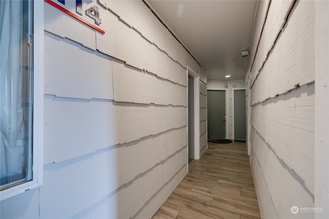 hallway featuring wood-type flooring