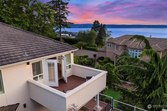 deck at dusk with a water view